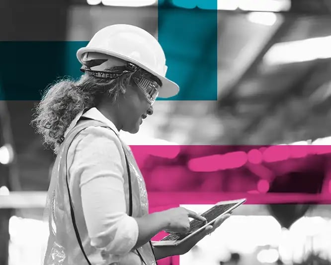 woman looking at ipad in warehouse