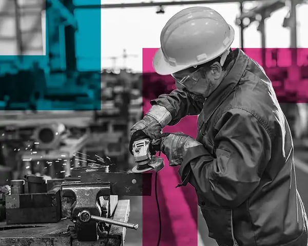 Man in safety gear using an angle grinder