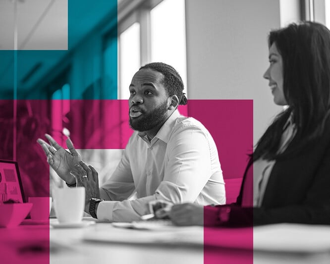 Woman and man in meeting inside office
