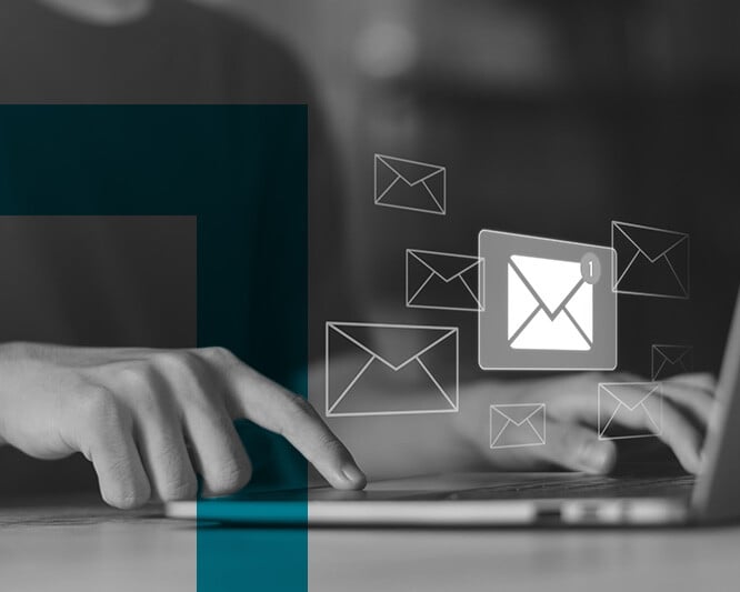 Email icons over a laptop